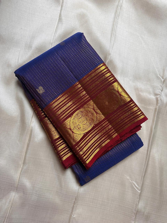 Pure Kanchipuram silk saree in sapphire blue with red border featuring traditional gold zari kattam checks handwoven in Kanchipuram