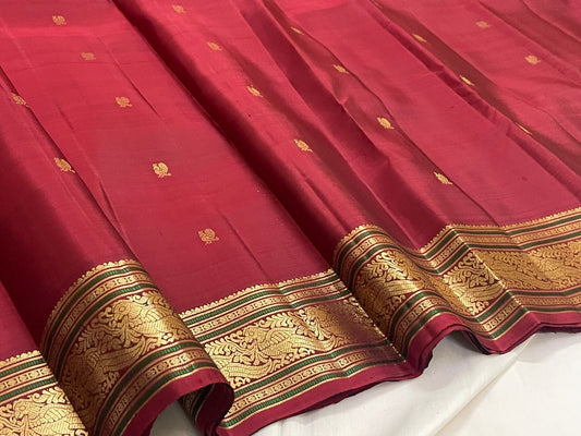 Kanjivaram silk saree pomegranate red full view with traditional gold motifs
