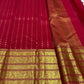 Poppy red Kanchipuram silk saree folded view with gold varisaipet border and zari butta