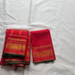 Red pure Kanchipuram silk saree with zari kattam mayil butta and bottle green selvedge folded view
