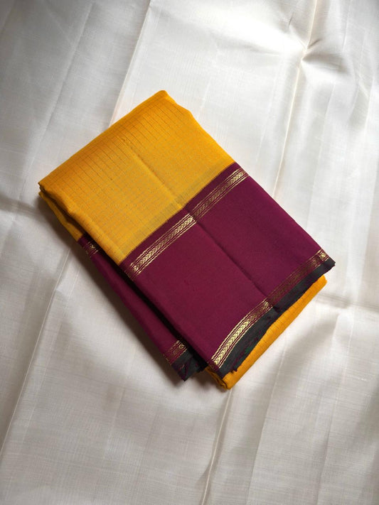 Honey mustard Kanjivaram silk saree with peacock blue green shot border folded view