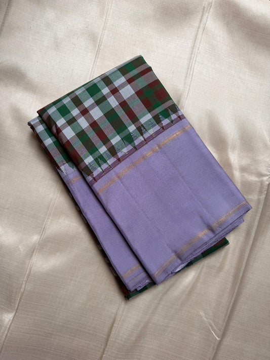 Kanchipuram silk saree lavender mist body with emerald checks pallu rettapet border draped view