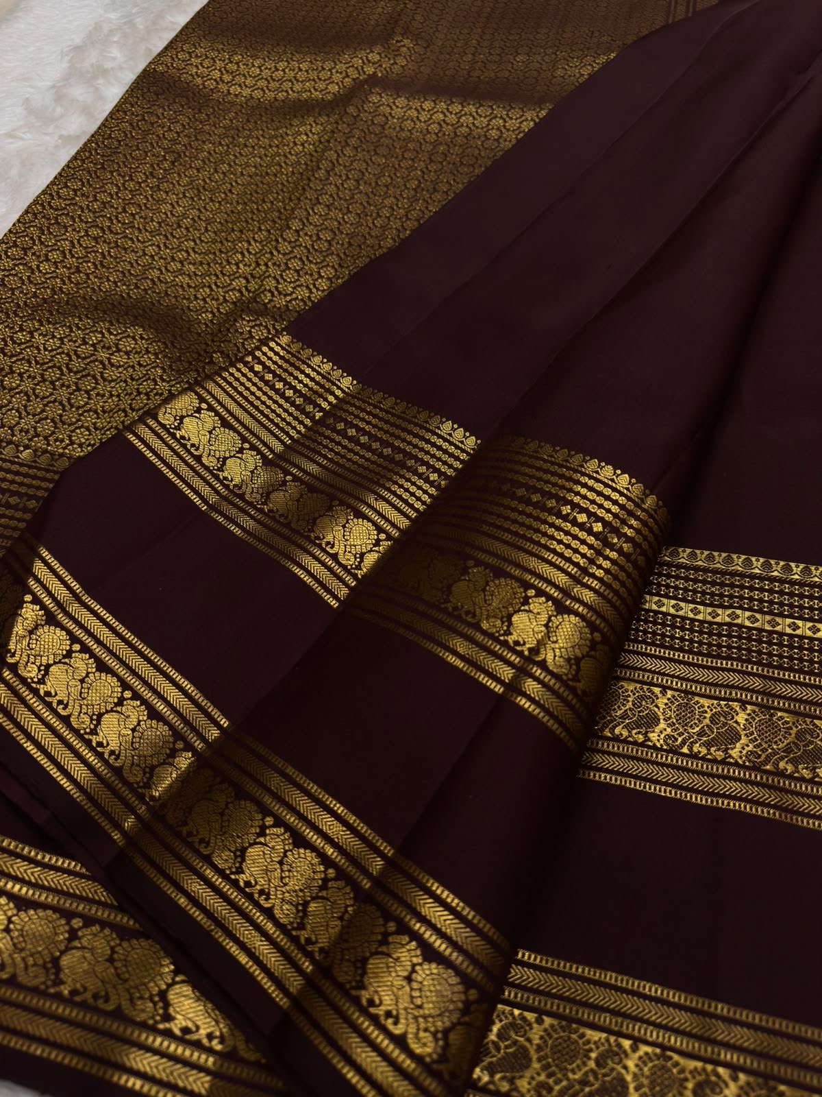 Arakku brown pure silk saree with a dense antique gold floral zari pallu