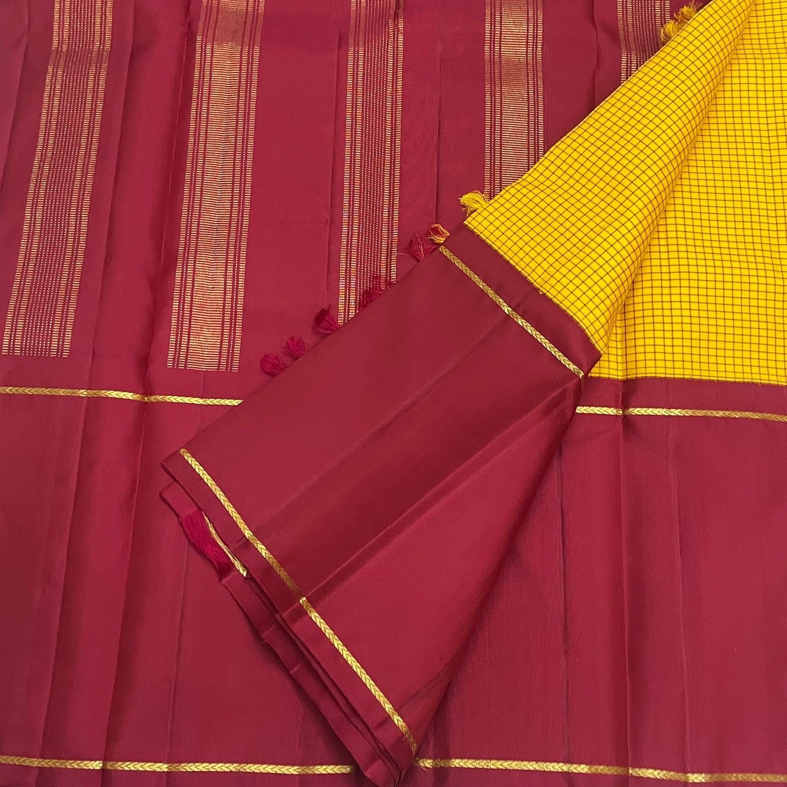 Kancheepuram silk saree saffron body with checkered weave close up