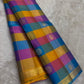 Kanjivaram silk saree yellow blue pink check pattern draped view
