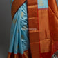 Pure silk saree in sky blue with pichwai inspired design and antique gold zari woven border
