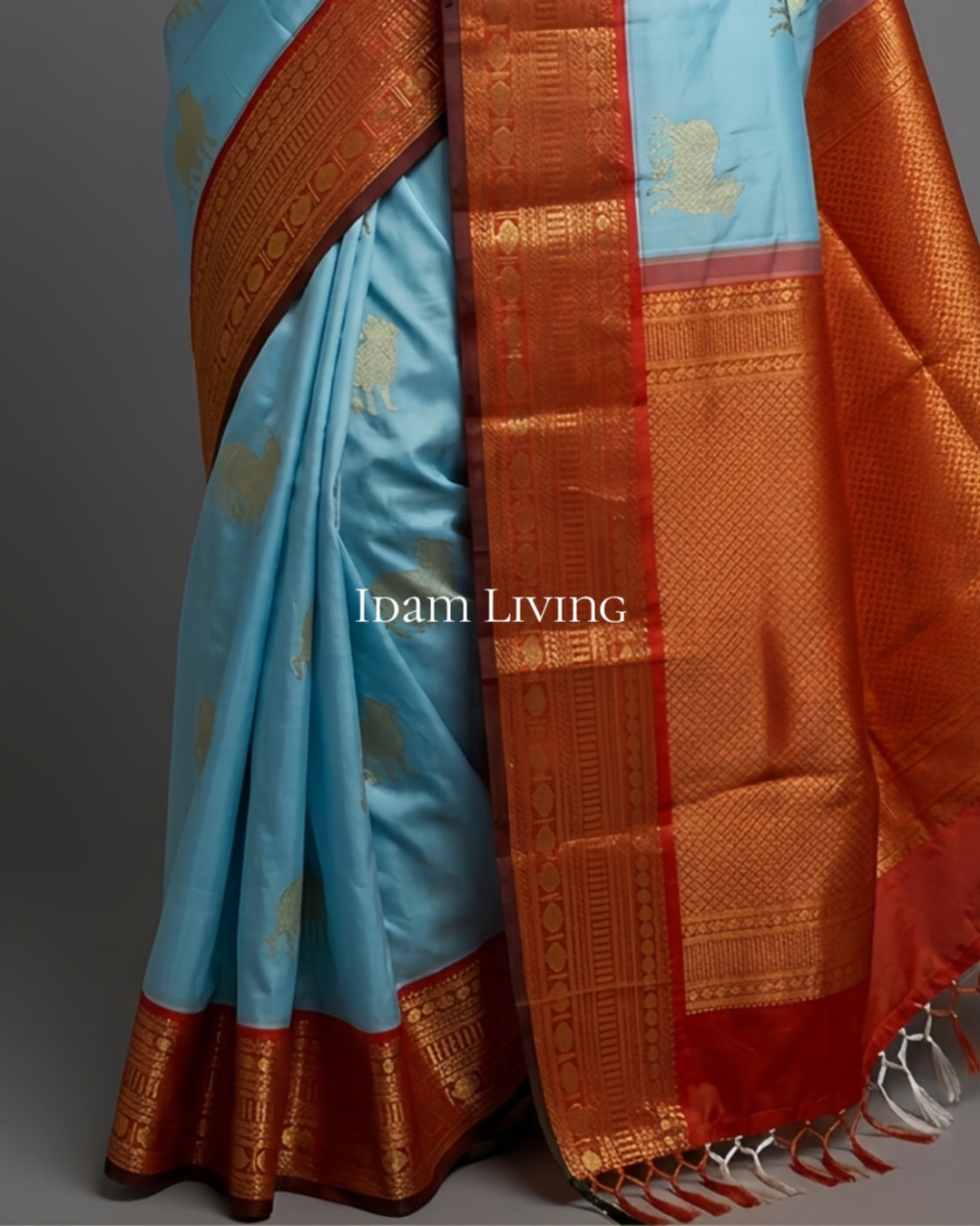 Pure silk saree in sky blue with pichwai inspired design and antique gold zari woven border