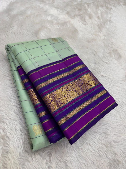 Kanjivaram silk saree pistachio pastel green with purple border folded view