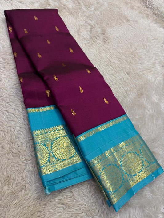 Velvet berry Kanchipuram silk saree with cerulean border folded view showing zari buttas
