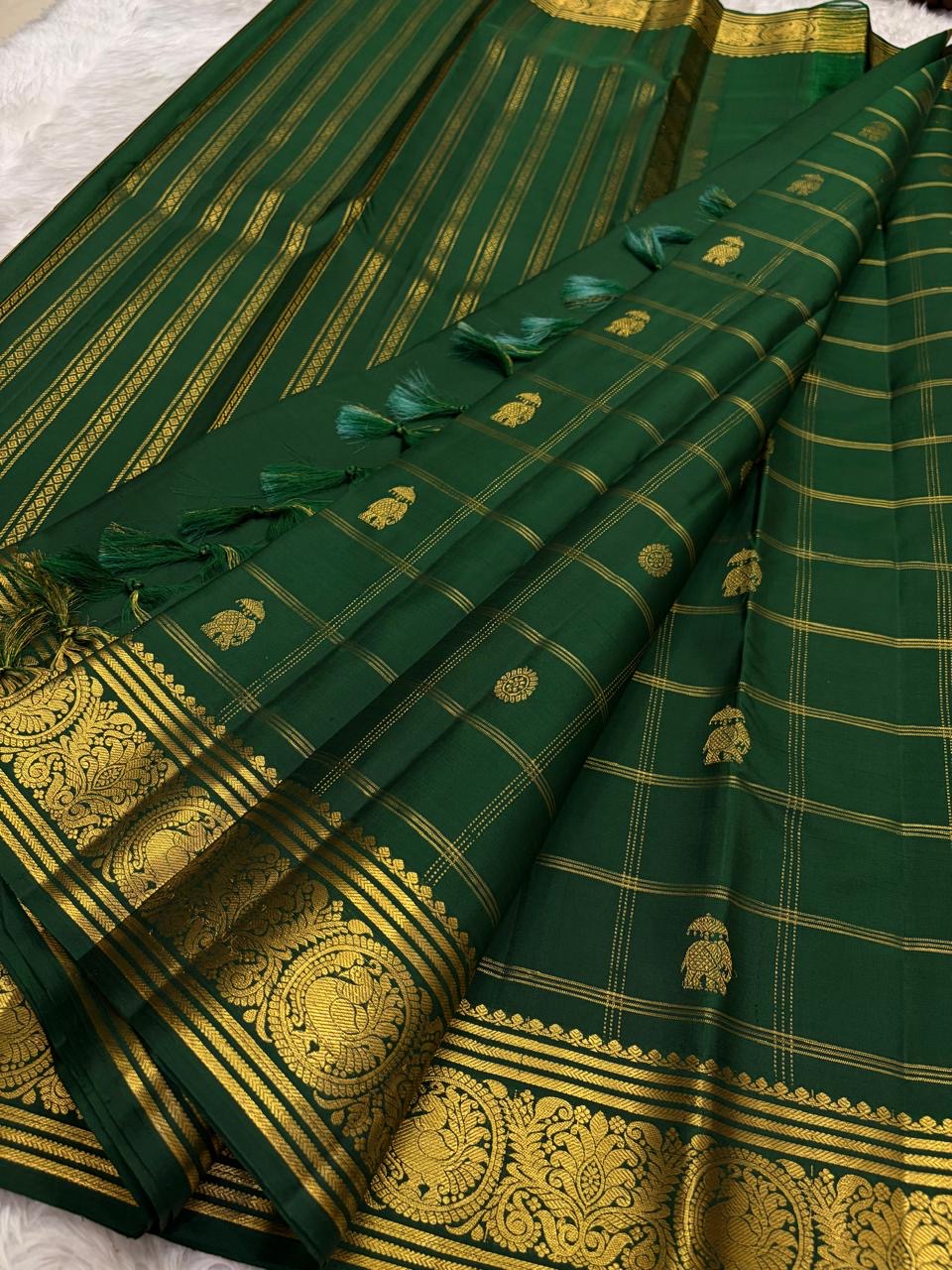 Kanchipattu silk saree yaanai butta motifs on green silk