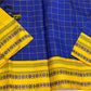 Full view of royal blue checked pure Kanchipuram silk saree with mustard yellow pallu section and contrast woven borders