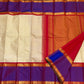 Full spread pure Kanchipuram silk saree with ivory striped body, purple border, and orange zari woven pallu, available in the USA