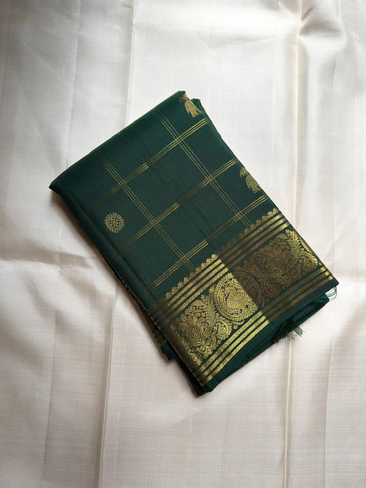 Bottle green Kanjivaram silk saree with zari kattam checks folded view