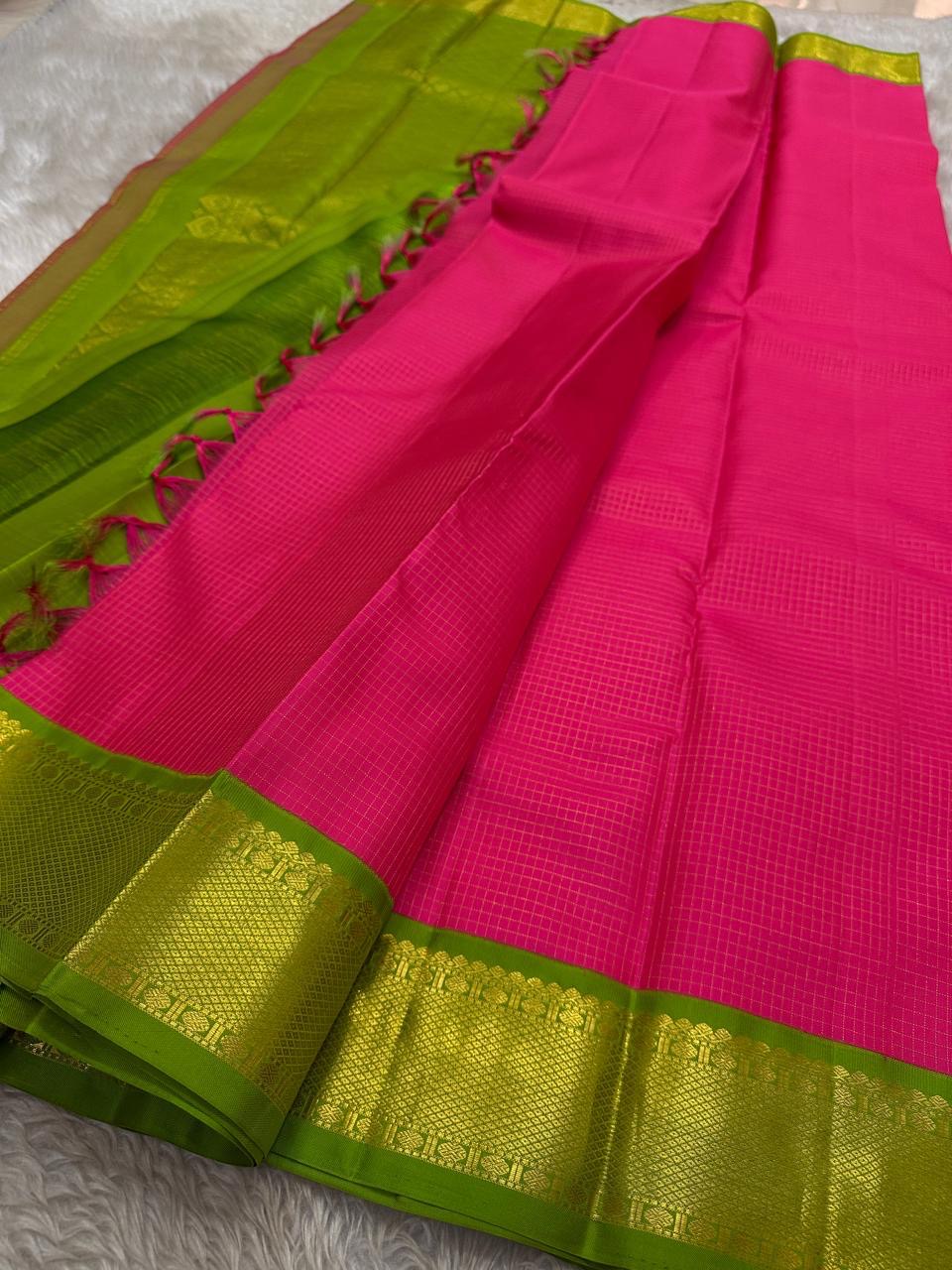traditional tested zari detail on rose ember Kanchipuram silk saree