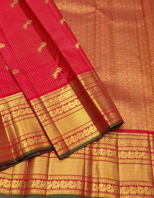 Zari kattam red Kanchipuram silk body with traditional tested zari motifs across the silk