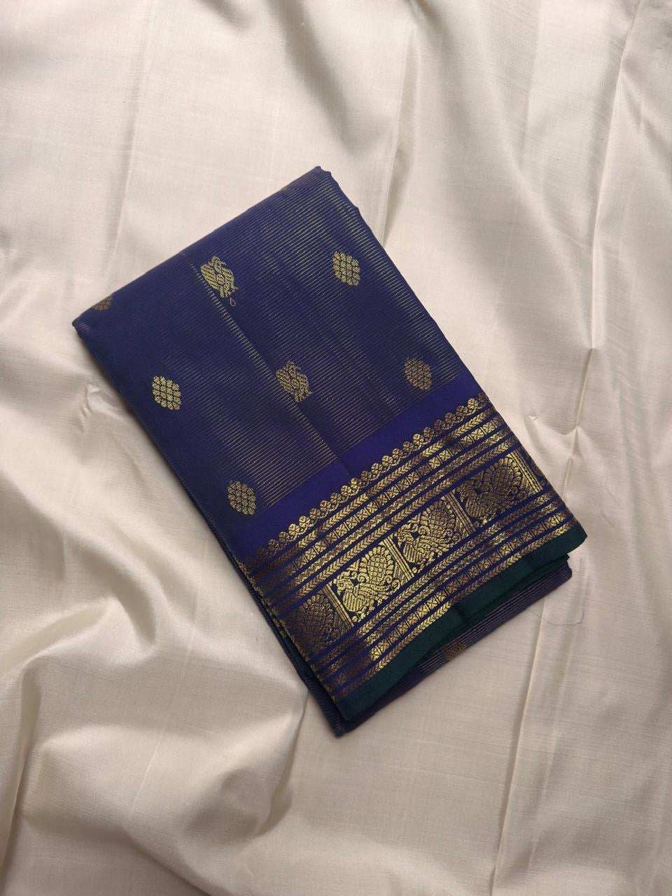 Violet Kanchipuram Vairaoosi silk saree pallu with ornate gold zari panels and traditional woven details