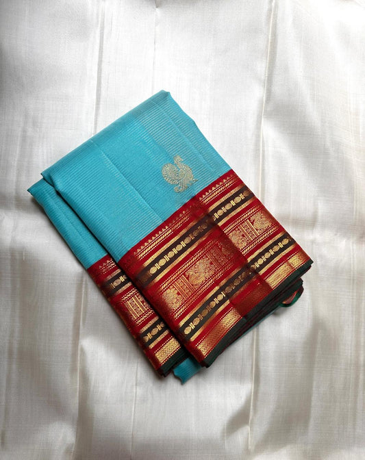 Pure Kanchipuram silk saree in sky blue with traditional gold zari varisaipet border by Idam Living