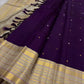 Deep purple Kanchipuram silk saree with scattered zari buttas and wide sandalwood gold Varisaipet border.