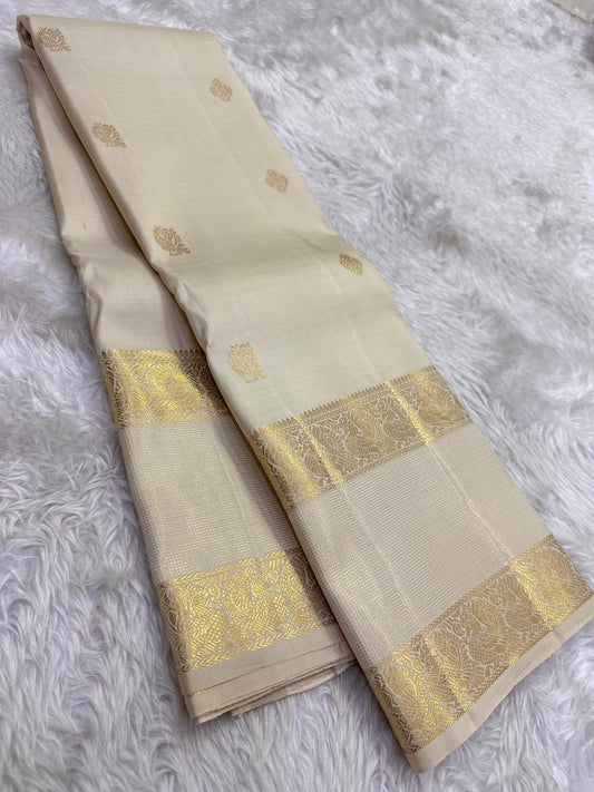 Stylized bird motifs in gold zari border on Warm Ivory Kanchipuram silk