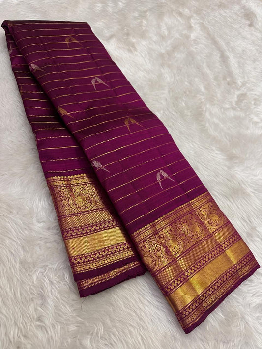 Naval Pazham purple Kanchipuram silk saree with fine gold zari lines in the Vairaoosi weave