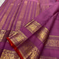 Pallu with tall zari panels, mayil-vanki motifs and kodi-malar flourishes on rose pink purple Kanchipuram saree