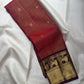 Kanchipuram Vairaoosi silk saree in rust red — zari butta motif close-up