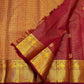 Close-up of the fine Vairaoosi weave texture on the Arakku maroon Kanchipuram silk saree