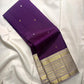 Close view of expansive sandalwood gold zari pallu with layered bands and lilac accents.