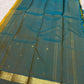 Turmeric yellow and peacock blue slim-border Kanchipuram silk saree by Idam Living