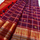 Arakku Red, Deep Violet & Muted Blue Pure Kanchipuram Silk Kanchi Kattam saree showing traditional handwoven body and richly detailed border.