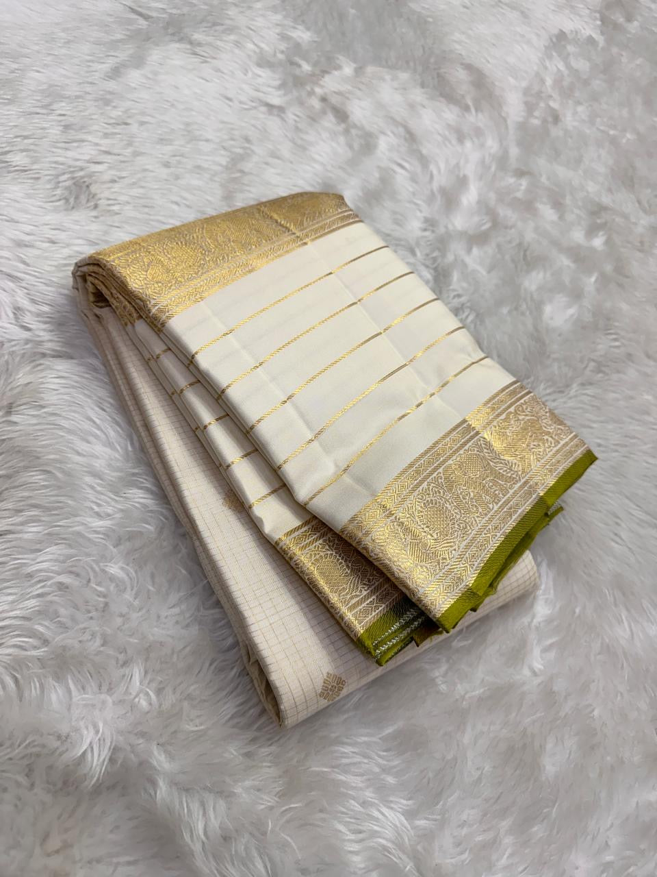 Ivory pure silk Kanchipuram saree, handwoven pure silk with pearl ivory, pale gold and thulir-pachai fresh-green selvedge