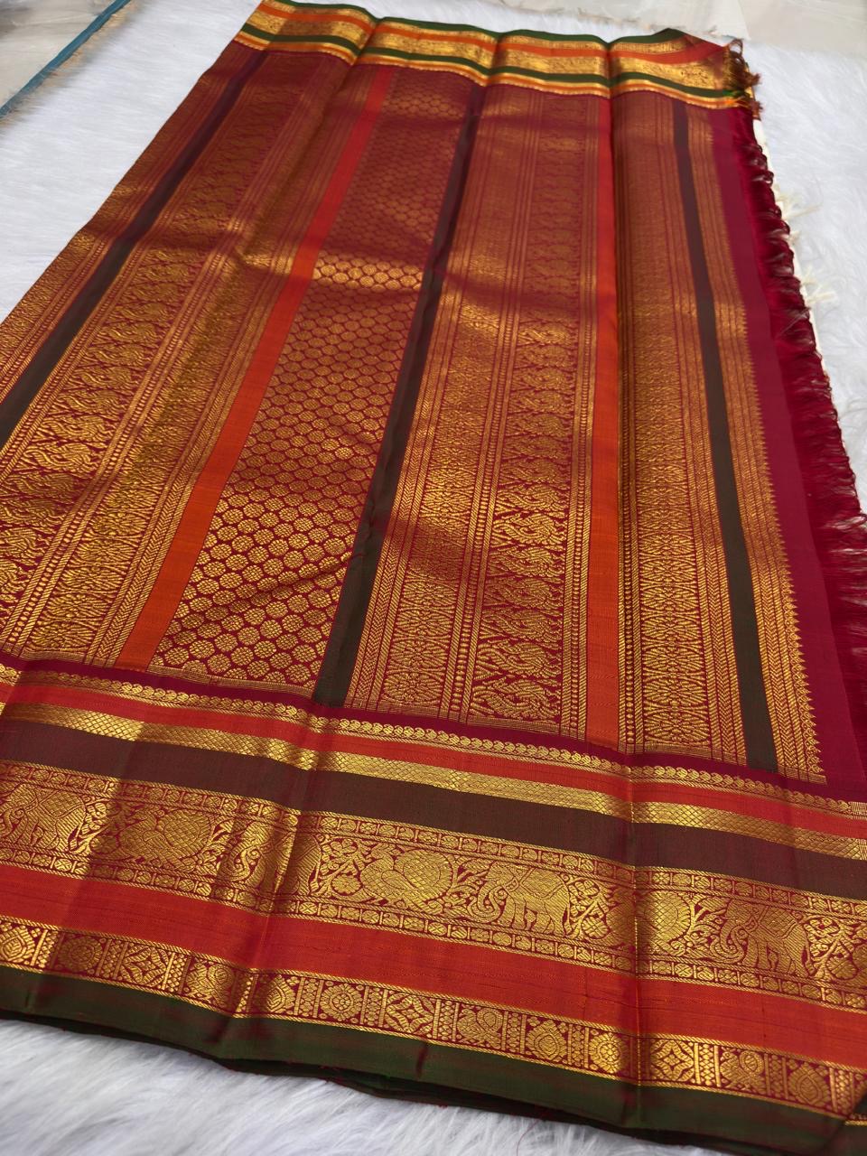 Ivory pure silk Kanchipuram saree, traditional border gold zari with warm ivory with arakku-red, vermilion and manthulir-green accents