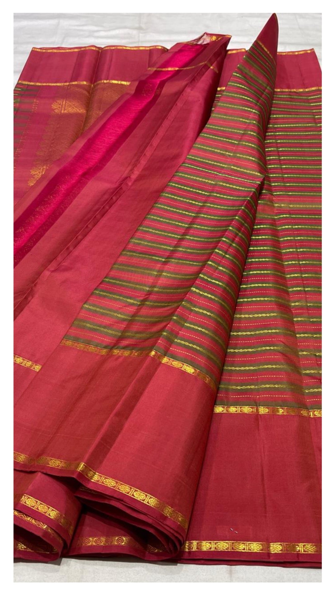 olive green border detail of vazhaipoo crimson pink Kanchipuram silk saree