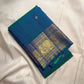 Peacock Blue, emerald green, royal blue and antique gold handwoven Kanchipuram butta silk saree, folded front, with gold zari detailing.