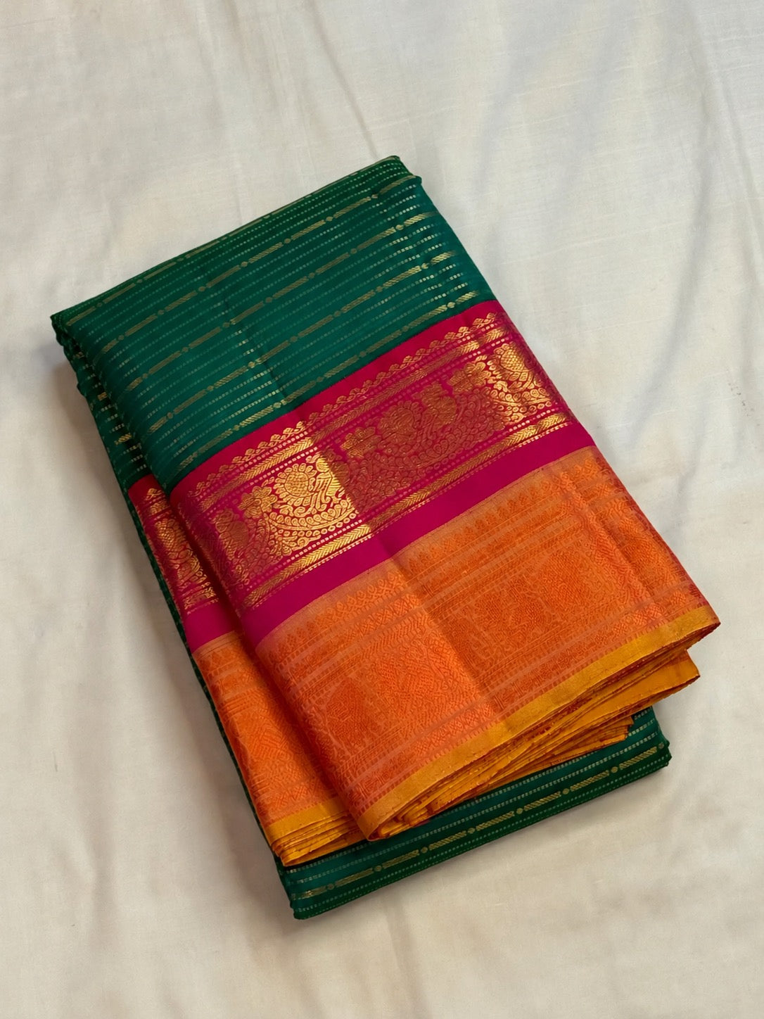 Peacock teal Korvai pure silk Kanchipuram saree with thick Veldhari body, double Korvai border and sunset-orange grid pallu, Idam Living (photo 2 of 5)