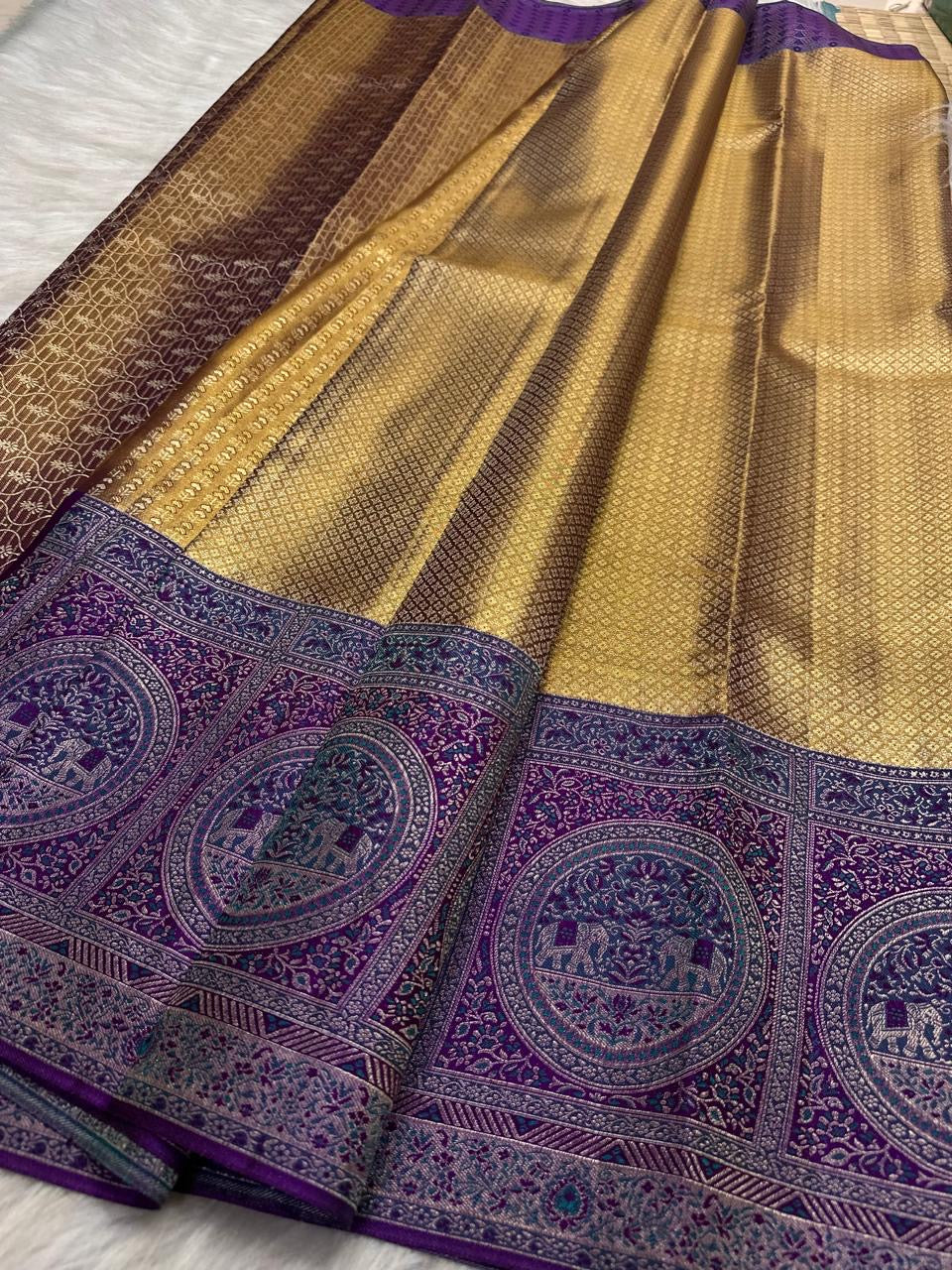 Antique gold handwoven pure silk Banarasi-Kanchipuram fusion saree with Kathiripoo purple, gold zari latticework and elephant medallions