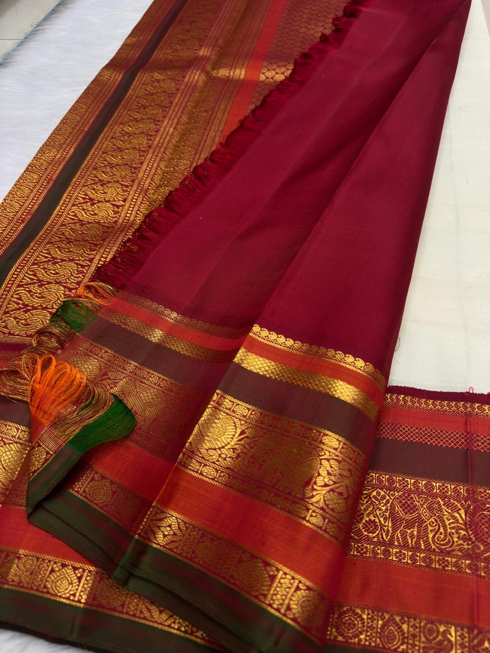 Ivory pure silk Kanchipuram saree, handwoven pure silk with warm ivory with arakku-red, vermilion and manthulir-green accents