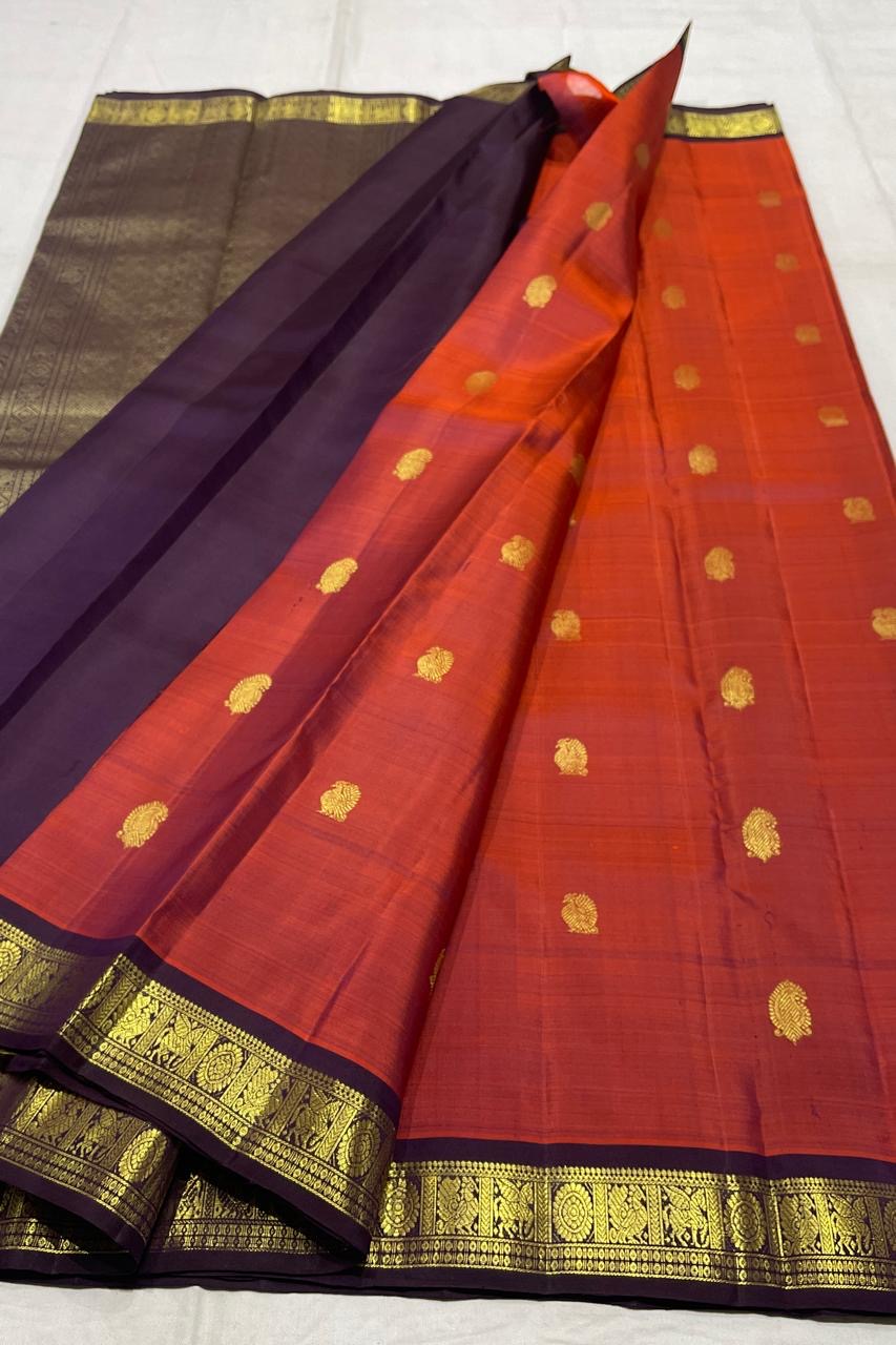 Rust and aubergine handwoven pure silk Kanchipuram Korvai saree — close view of the body weave and texture