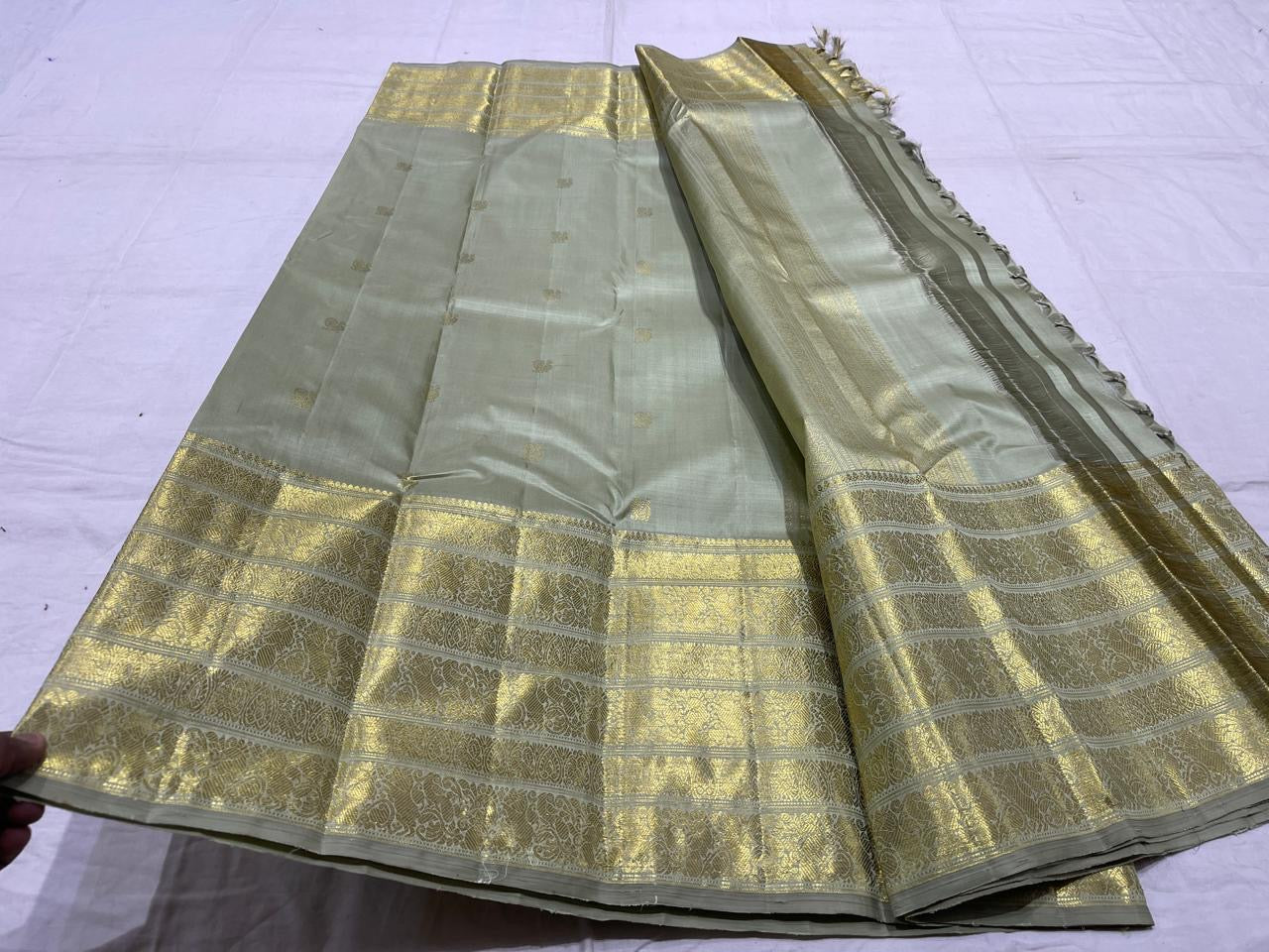 Sage green handwoven pure silk Kanchipuram Varisaipet saree — overview of the full saree drape