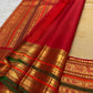 Sandalwood ivory Kanchipuram silk saree body with gold buttas.