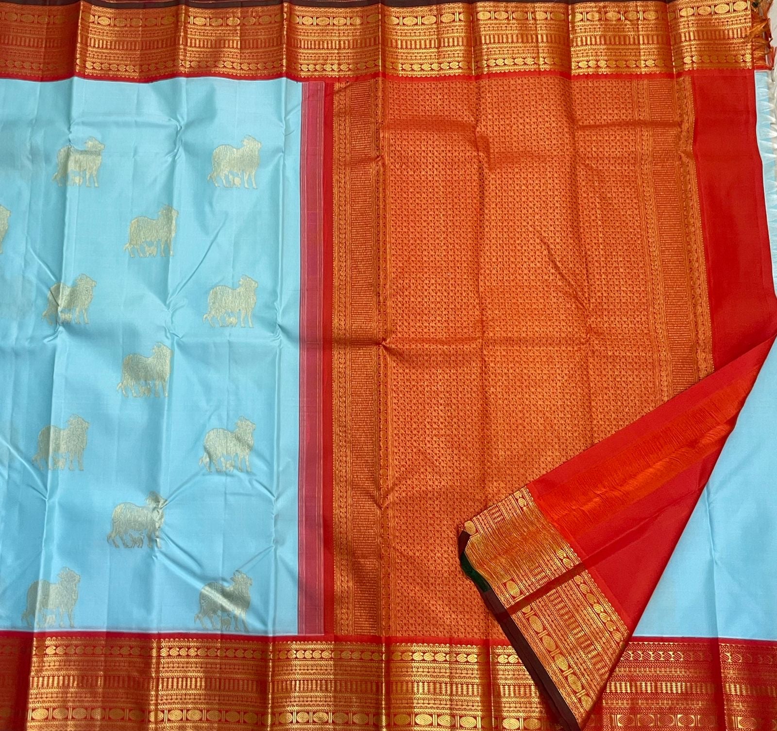 Pichwai Kanchipattu silk saree in sky blue with ornamental antique zari border close view