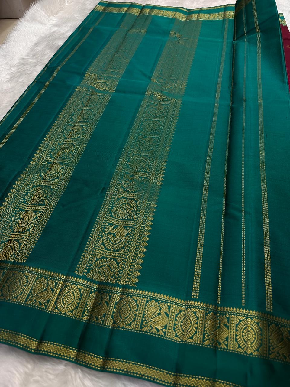 Handwoven lightweight Kanchipuram saree in maroon with gold zari medallions