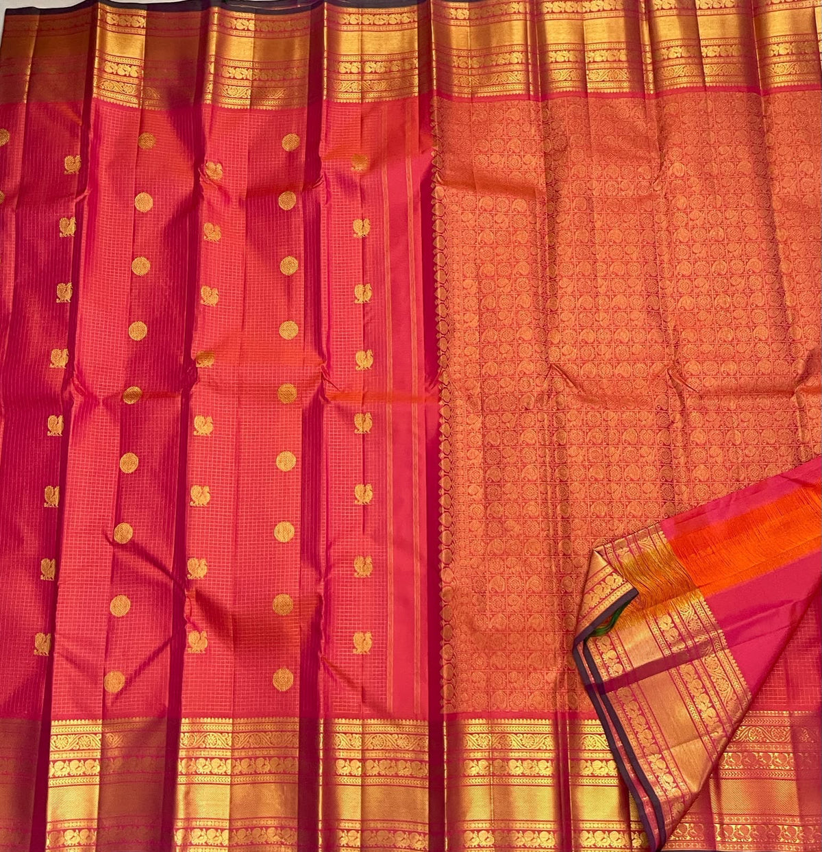 Grand pallu of the coral sunset Pure Silk Kanchipuram Zari Kattam saree