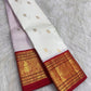 Warm ivory handwoven pure silk Kanchipuram Kai Korvai saree with gold zari flying horse buttas and temple-red border