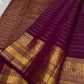 Pure silk Kanchipuram saree in deep berry purple with an elaborate antique gold zari pallu