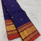 Deep Oodha blue Pure Kanchipuram Silk Zari Kattam saree with kesari-orange border worn at a temple satsang gathering