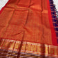 Ornate pallu and border of Arakku Red, Deep Violet & Muted Blue Kanchi Kattam Kanchipuram silk saree with traditional zari and silk-thread work.