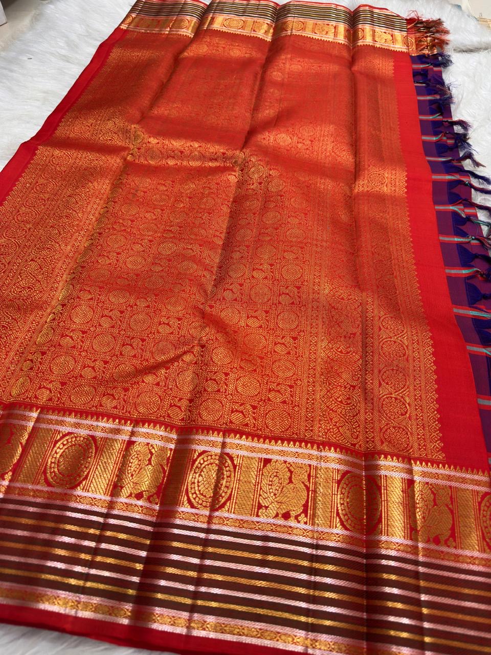 Ornate pallu and border of Arakku Red, Deep Violet & Muted Blue Kanchi Kattam Kanchipuram silk saree with traditional zari and silk-thread work.