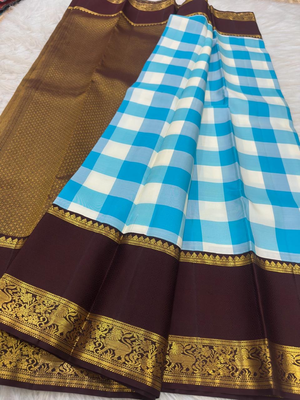 Vintage sky blue Paalum Pazhamum Kanchipuram silk saree showing grand zari pallu and ornate zari border