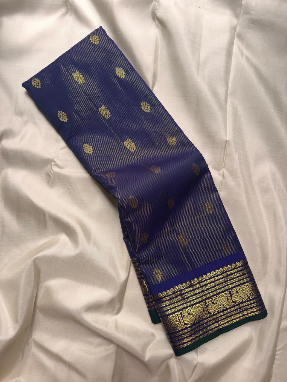 Violet Pure Kanchipuram Silk Vairaoosi saree with fine zari lines, gold motifs and traditional peacock border